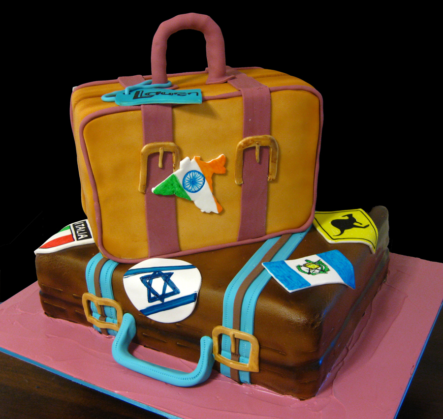 Travel themed sculpted suitcase cake 