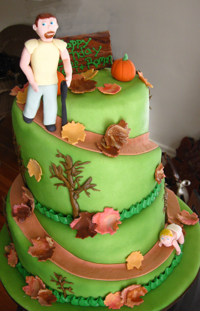 father and son hill with fall leaves cake